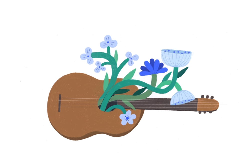 אסתי ניסים מלווה בגיטרה וזר פרחים שרה ומנגנת לילדים בבית מאניה